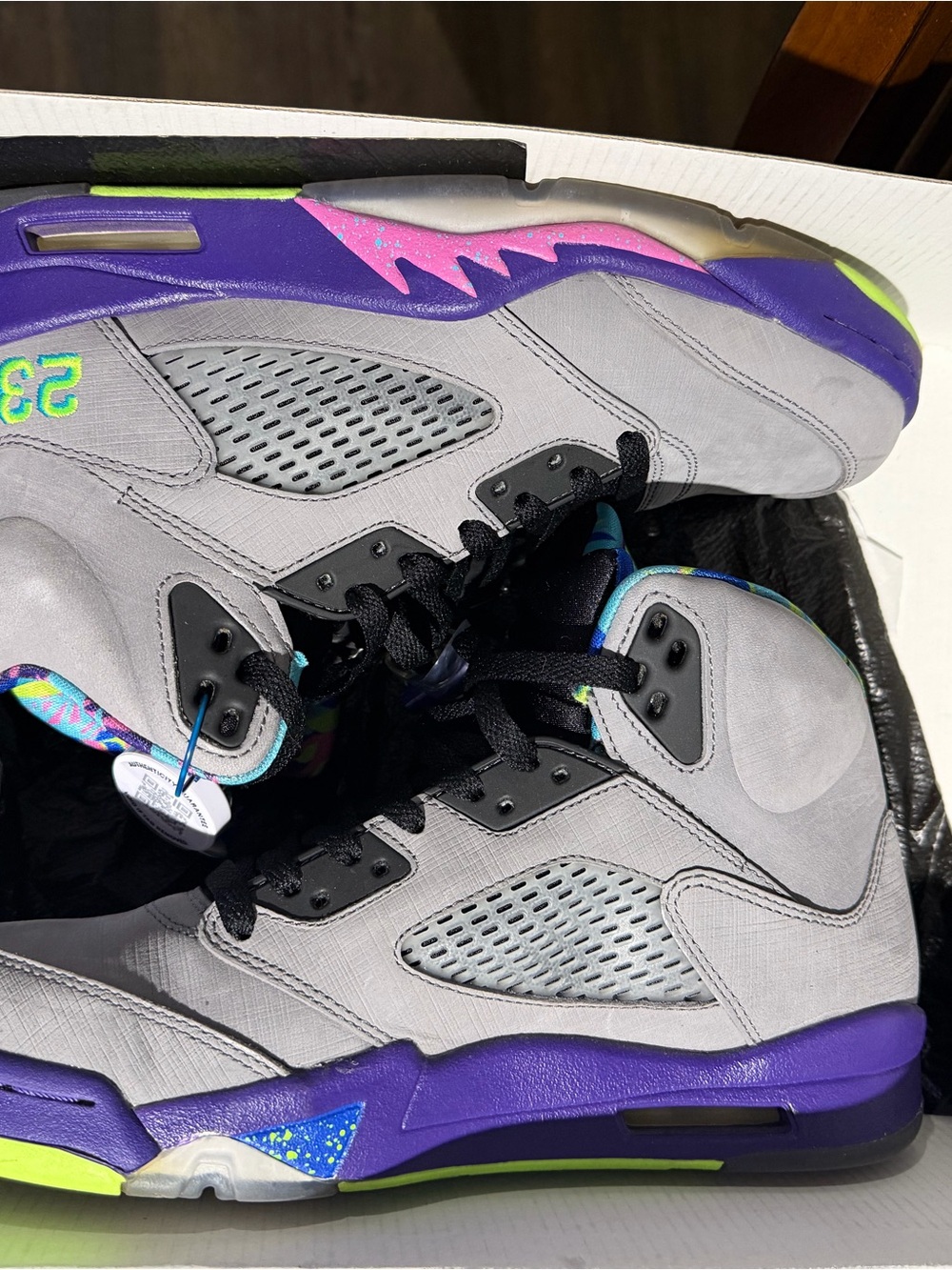 Jordan women’s Gray Sneakers with Purple and Neon Green Accents